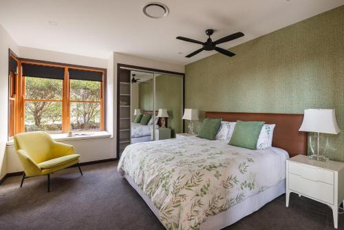 a bedroom with a bed and a ceiling fan at The Haven Montville in Montville