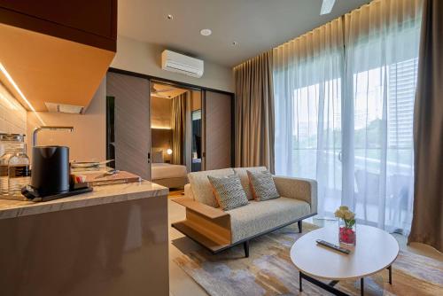 a living room with a couch and a table at Antara Genting by COBNB - Antara AIR Genting Highlands in Genting Highlands