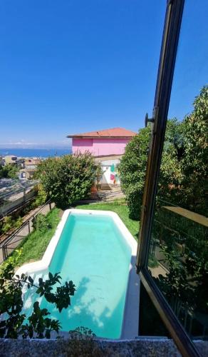 a view of a swimming pool from a window at Hotel boutique Paihuen in Valparaíso