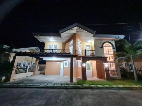 a large house at night with a driveway at Panglao Ramyer Villa 1 in Sampong