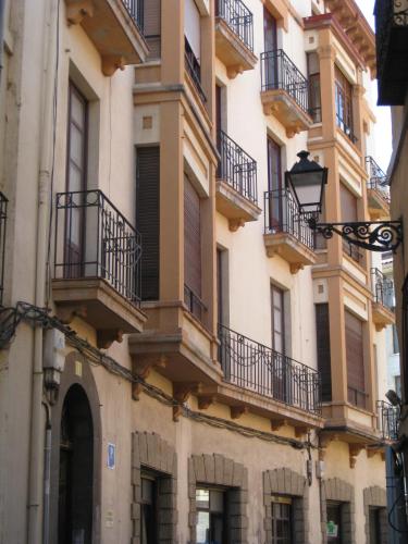 a building with balconies on the side of it at Pensión Sandoval by gaiarooms in León