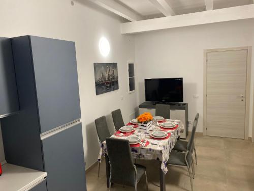 a dining room with a table and chairs at La Tavernetta delle Terme Euganee in Montegrotto Terme
