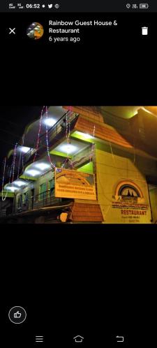 a poster of a train on the tracks at Rainbow Guest House in Mahabalipuram