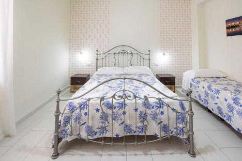 En eller flere senge i et værelse på Casa Vacanze L'Onda