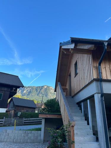 a house with stairs leading up to it at Panorama Loft Bad Aussee in Bad Aussee