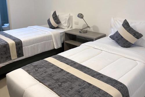 Postel nebo postele na pokoji v ubytování UTD8 Hotel and Residence