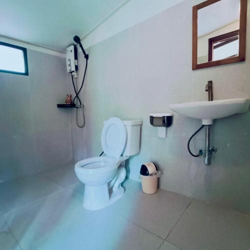 a bathroom with a toilet and a sink at Jungle Koh Kood Resort in Ko Kood