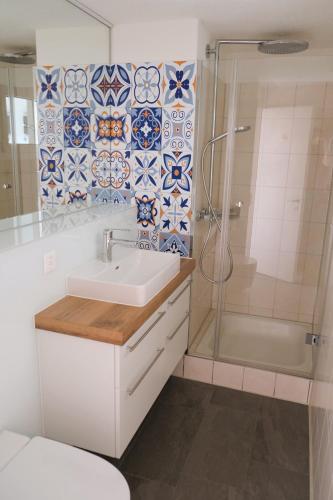 a bathroom with a sink and a shower at Ferienhaus Mostelrain in Sattel