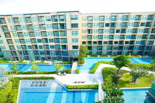 an aerial view of a large apartment building at Raincondo Ampere in Cha Am
