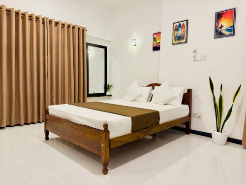 a bedroom with a large bed in a room at Abheena - Weligama in Weligama