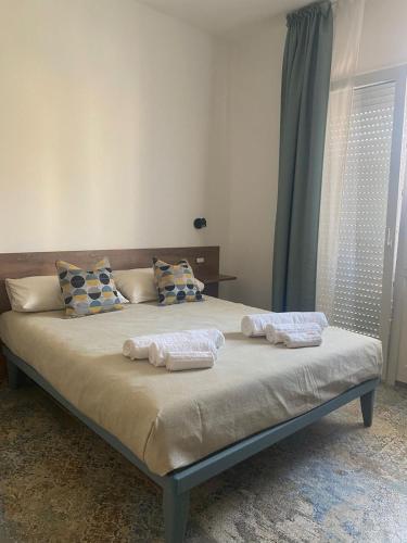Giường trong phòng chung tại Dimora del Salento Apartment
