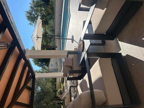 an overhead view of a building with a balcony at Villa Mali Raj in Žikovići