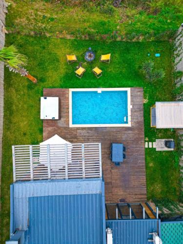 an overhead view of a pool with chairs and a fence at Stay in Sapanca in Sapanca
