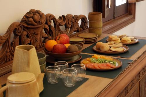 a table with plates of food on top at Boutique Hotel Bodega CICLO ANDINO in Perdriel