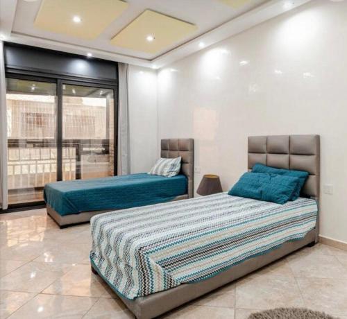 Ένα ή περισσότερα κρεβάτια σε δωμάτιο στο luxury apartment in casablanca