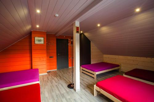a small room with two beds in a cabin at Anupro Villa in Trakai