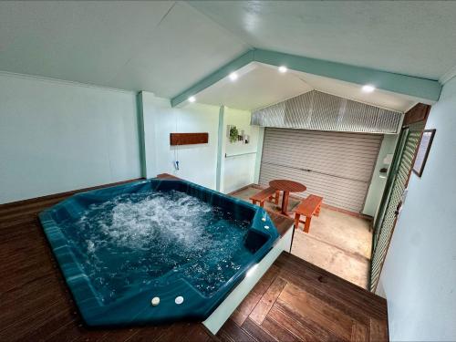 a large blue tub in the middle of a room at Wild Hearts Cottage in Wallaroo