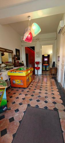 a living room with a ping pong table on a tile floor at Château de Seurre No Boring People in Seurre