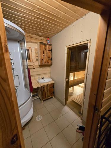 a bathroom with a toilet and a sink at Tammetalu puhkemaja 