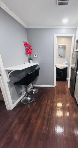 a living room with a desk and a counter at My lil doll house in Elizabeth