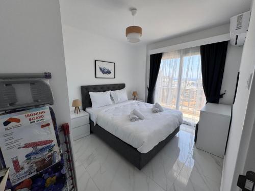 a bedroom with a bed with two stuffed animals on it at İsmail Yılmaz Hotel in Trabzon