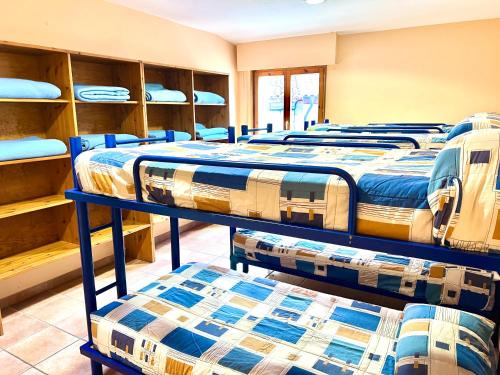 a row of beds in a room at Albergue Urbasa in Eulate