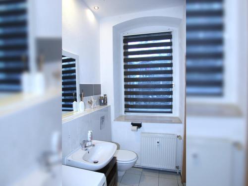 Ένα μπάνιο στο Komfortable Ferienwohnung Ankerlicht und Stillvolle Ferienwohnung Kronenlicht