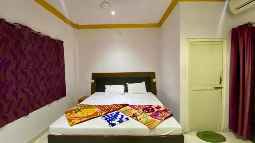 Postel nebo postele na pokoji v ubytování Jasodha Resort