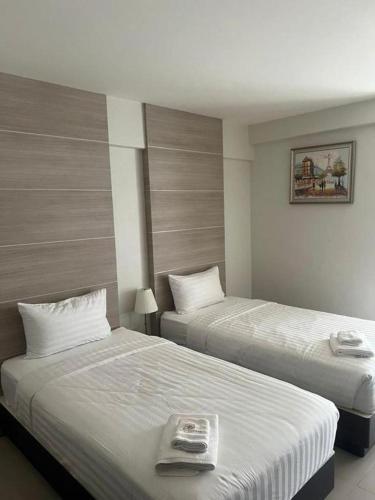 a hotel room with two beds in a room at Paradise Otel 