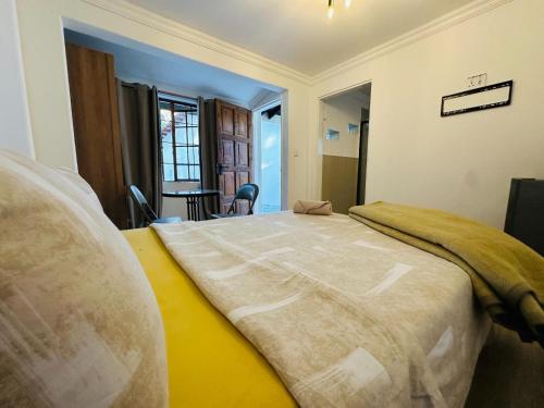 a bedroom with a large bed in a room at NelsBNB in Nelspruit
