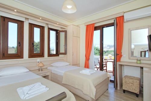 Ένα ή περισσότερα κρεβάτια σε δωμάτιο στο Agnanti Houses