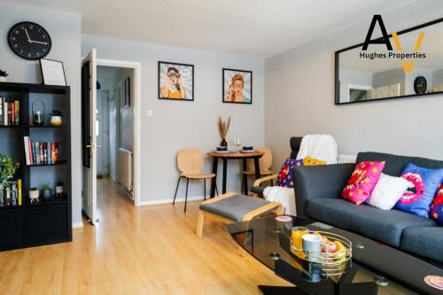 a living room with a couch and a table at Northampton Pop Art House - Free Parking - Fast Wi Fi by AV Hughes Properties in Northampton