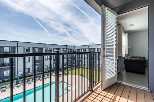 a balcony with a view of a swimming pool at Affordable 2-Bedroom Fishers Pool View in Fishers