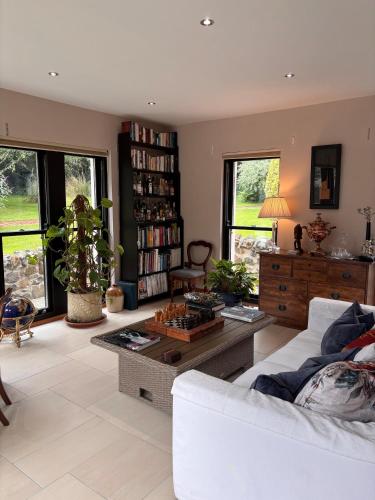 a living room with a couch and a table at The Barn, Walworth Demesne in Ballykelly
