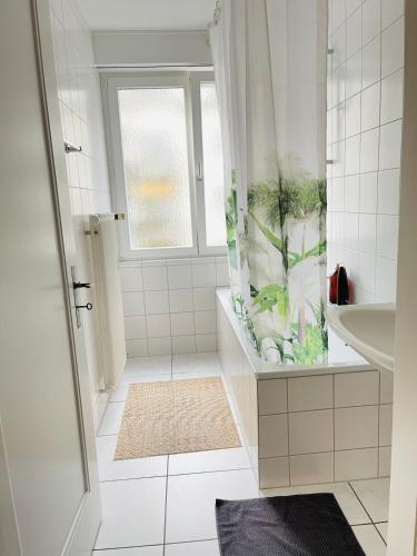 a bathroom with a fish tank in the shower at Vantage Point 101 in Olten