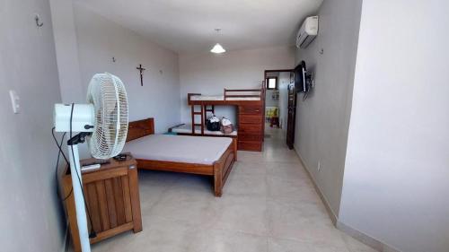 Ένα ή περισσότερα κρεβάτια σε δωμάτιο στο Lindo Apartamento Varandas do Atlântico