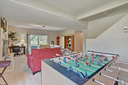 a living room with a large foosball table at 120 Winding Meadow in Monument