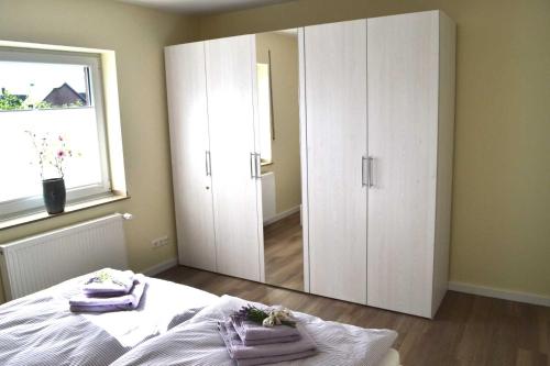 Postel nebo postele na pokoji v ubytování 4 Sterne Ferienwohnungen Lavendel Brüggen