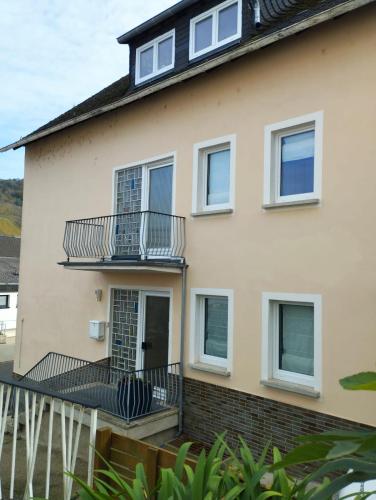 a house with balconies on the side of it at Ferienwohnung Moselherz in Reil