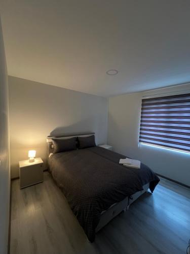 a bedroom with a bed and a window at Apartment Lana Vareš in Vareš