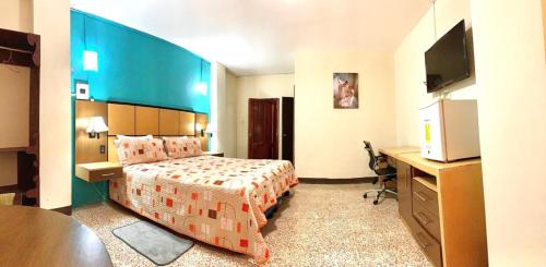 Postel nebo postele na pokoji v ubytování Hotel Manta Real