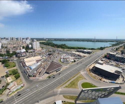 an aerial view of a city with a highway at Your Flat Lebedinny in Kyiv