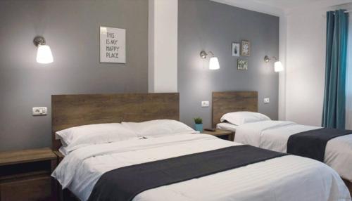 Ένα ή περισσότερα κρεβάτια σε δωμάτιο στο Pensiunea La Mustata