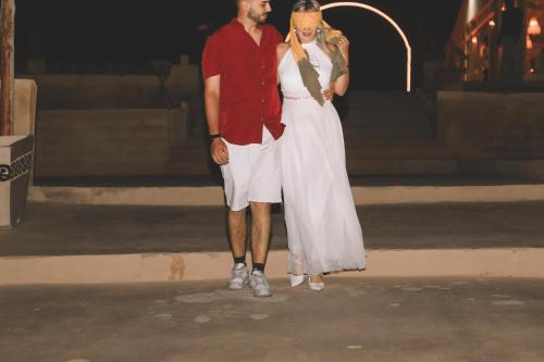 a man and a woman standing next to each other at Agafay Luxury desert Camp - Glamping Experience in Aït Mazou