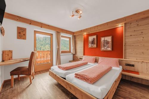 Una cama o camas en una habitación de Gasthof Leiter´s Hoamatl