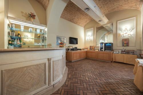 a large room with a bar in a store at Hotel Flavia in Rome