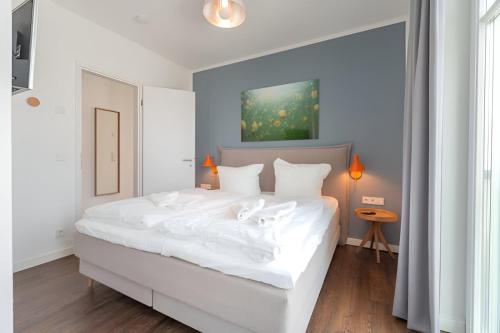 Postel nebo postele na pokoji v ubytování Quartier Schneespecht Westendpalais