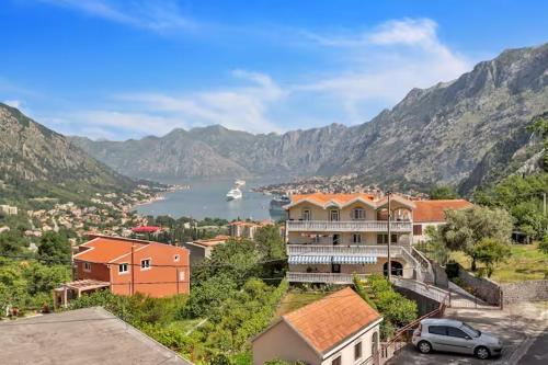 a view of a town with a lake and mountains at Apartman Tamara i Tijana in Škaljari