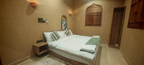 Ένα ή περισσότερα κρεβάτια σε δωμάτιο στο Shwathina Inn نزل شواذنة