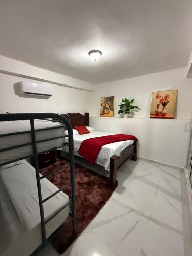 Postel nebo postele na pokoji v ubytování R&N tropical